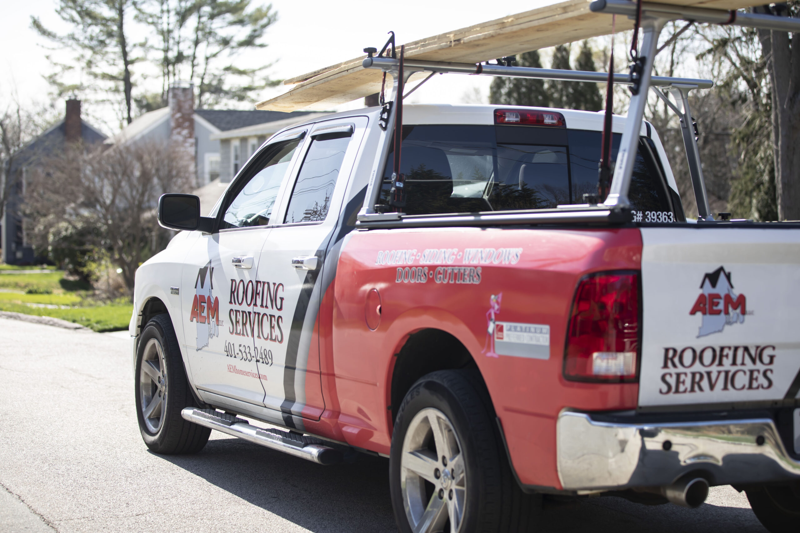 a view from the rear corner of an AEM-branded pickup truck
